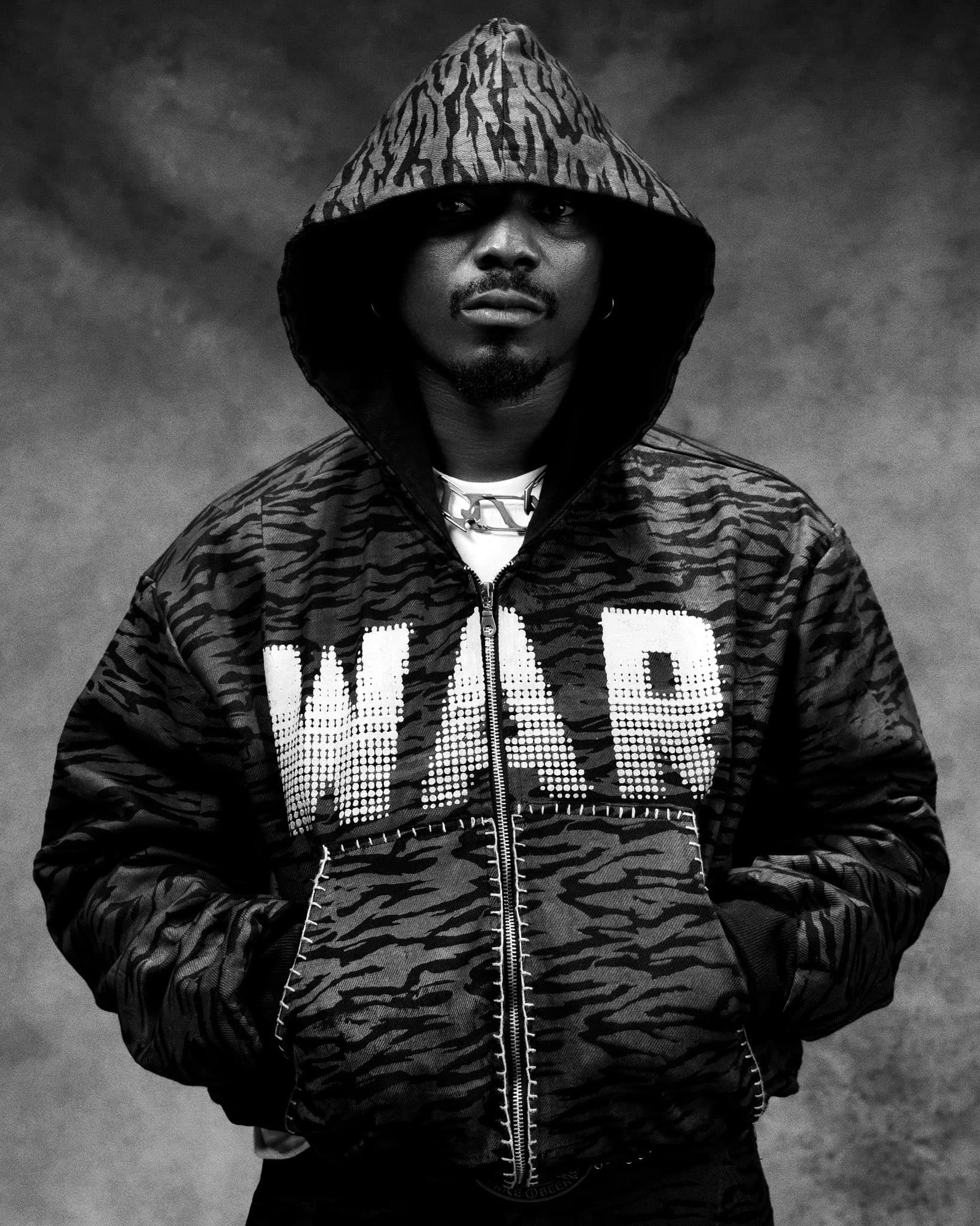 llona wearing a hoddie that says WAR